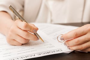 close-up-hand-signing-document